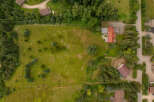Discover this expansive property featuring a large, open grassy field perfect for outdoor activities or potential development.