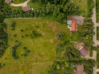 Discover this expansive property featuring a large, open grassy field perfect for outdoor activities or potential development.