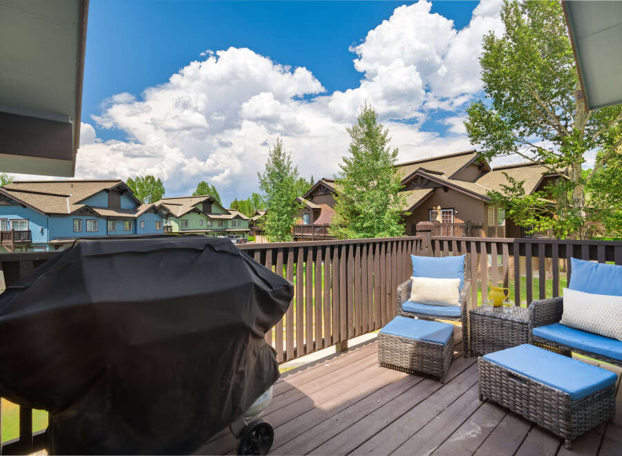 Enjoy outdoor living on this spacious deck, perfect for entertaining or relaxing.