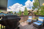 Enjoy outdoor living on this spacious deck, perfect for entertaining or relaxing.