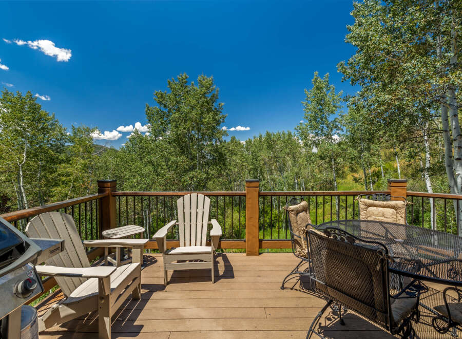 Enjoy the stunning mountain views from this spacious deck, perfect for outdoor entertaining.