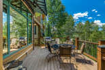 Enjoy outdoor living on this spacious deck, perfect for entertaining or relaxing amidst nature.