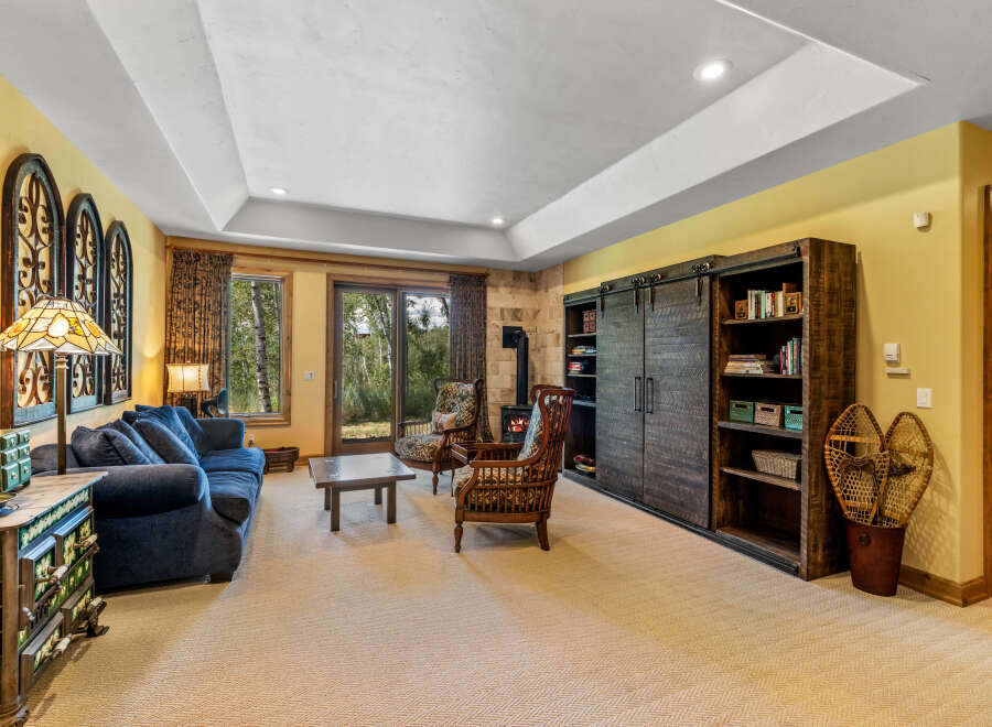 Step into this inviting living space featuring a plush blue sofa and two charming accent chairs, perfect for relaxation.