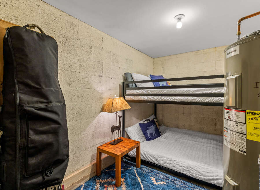This cozy room features a practical bunk bed setup, perfect for maximizing space.