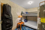 This cozy room features a practical bunk bed setup, perfect for maximizing space.