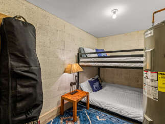 This cozy room features a practical bunk bed setup, perfect for maximizing space.