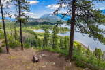 Experience breathtaking panoramic views from this stunning property, featuring a serene lake and majestic mountains as your backdrop.