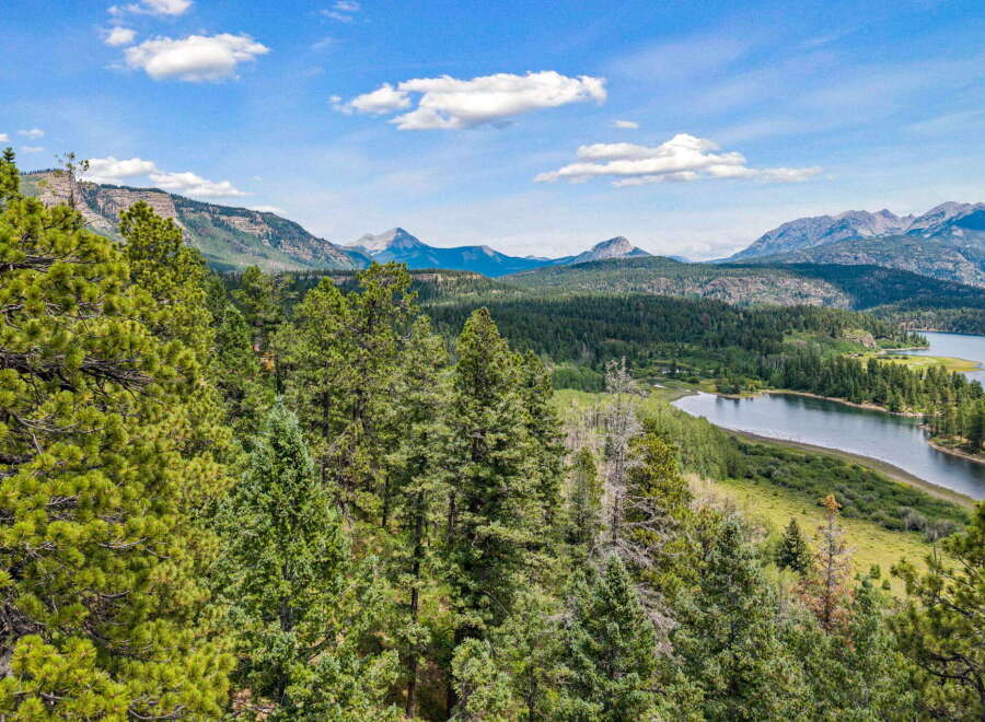 Discover breathtaking mountain views and serene lakefront living in this stunning property.