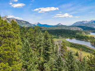 Discover breathtaking mountain views and serene lakefront living in this stunning property.