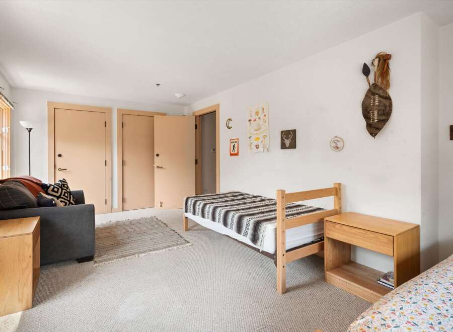 Discover this charming room featuring two twin beds, perfect for guests or a shared space.
