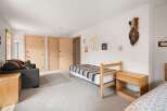 Discover this charming room featuring two twin beds, perfect for guests or a shared space.