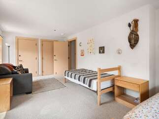 Discover this charming room featuring two twin beds, perfect for guests or a shared space.