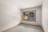This room offers a bright and airy atmosphere, perfect for relaxation or a home office.