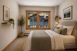 This charming bedroom offers a serene retreat with a comfortable bed dressed in crisp linens and accented with plush pillows.