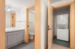 Discover modern convenience in this home, featuring a sleek bathroom with a vanity and a separate toilet area.