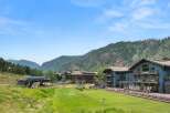 Experience luxury mountain living in this stunning property, featuring a ski lift and expansive green spaces perfect for outdoor activities.