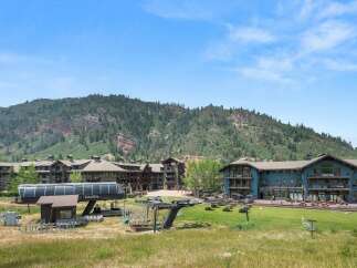 Experience the ultimate mountain getaway at this stunning resort, featuring luxurious accommodations and breathtaking views of the surrounding peaks.