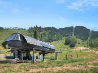 Experience the beauty of mountain living with this stunning ski lift station, offering breathtaking views and convenient access to scenic trails.
