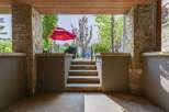 Step onto this inviting covered patio, perfect for enjoying the outdoors in any weather.