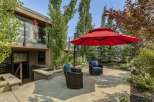 Enjoy outdoor living in this beautifully landscaped backyard featuring a spacious concrete patio perfect for entertaining.