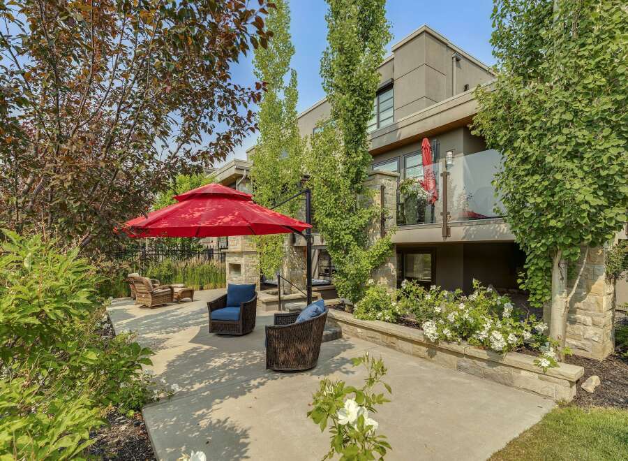 Enjoy outdoor living in this beautifully landscaped backyard featuring a spacious patio area perfect for entertaining.