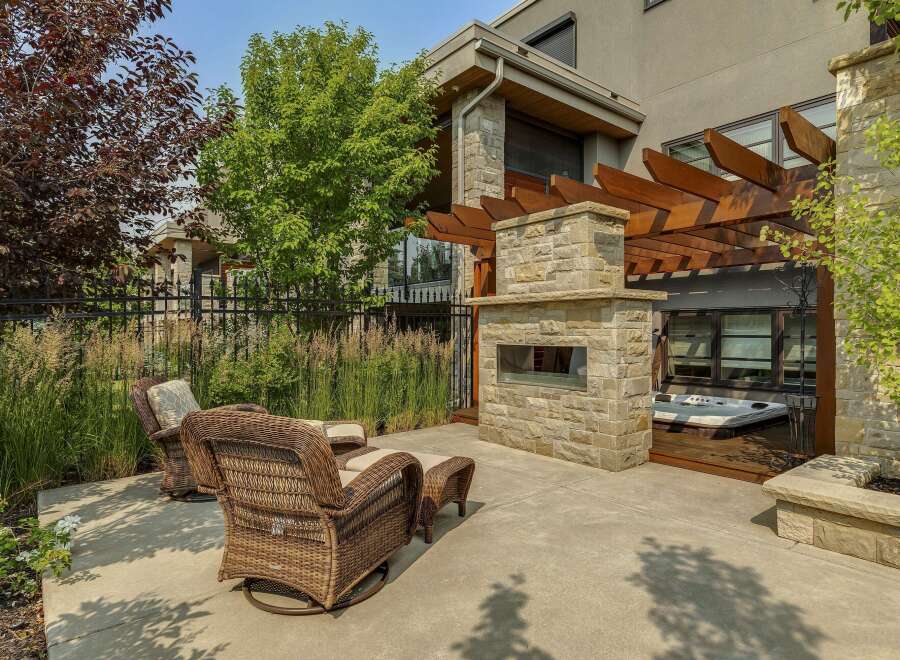 Experience ultimate relaxation in this luxurious backyard oasis, featuring a modern hot tub perfect for unwinding.