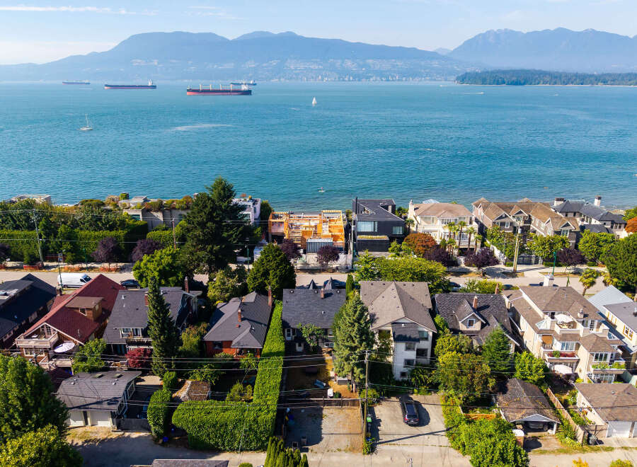 Experience coastal living at its finest with this stunning aerial view of a prime waterfront neighborhood.