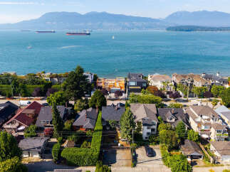 Experience coastal living at its finest with this stunning aerial view of a prime waterfront neighborhood.