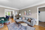 Step into this inviting living space, featuring a plush grey sectional sofa perfect for relaxation and entertaining.