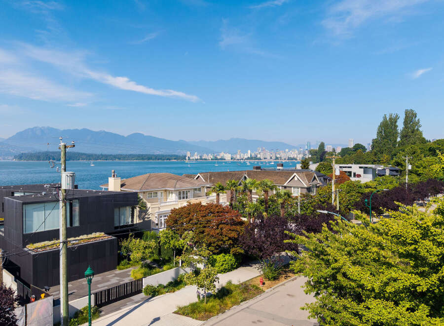 Experience luxury living with stunning water and mountain views from this prime real estate location.