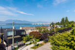 Experience luxury living with stunning water and mountain views from this prime real estate location.