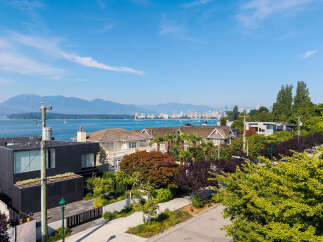 Experience luxury living with stunning water and mountain views from this prime real estate location.