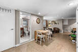 Discover this charming basement apartment featuring a compact dining area perfect for intimate meals.