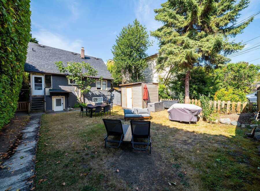 Enjoy outdoor living in this spacious backyard, perfect for entertaining or relaxing.