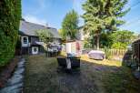 Enjoy outdoor living in this spacious backyard, perfect for entertaining or relaxing.