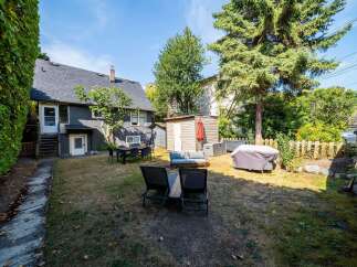 Enjoy outdoor living in this spacious backyard, perfect for entertaining or relaxing.