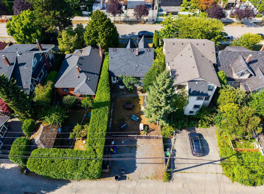 Discover this charming property featuring a well-maintained exterior with lush greenery and mature trees.