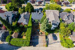 Discover this charming property featuring a well-maintained exterior with lush greenery and mature trees.