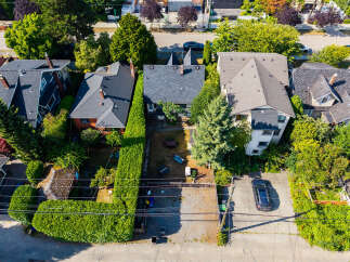Discover this charming property featuring a well-maintained exterior with lush greenery and mature trees.