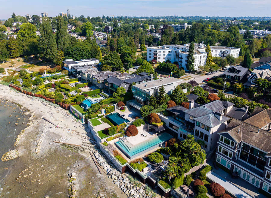 Experience unparalleled luxury with this stunning beachfront estate, featuring multiple swimming pools and meticulously landscaped gardens.