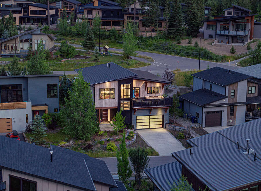 Discover modern luxury living in this stunning multi-level home, featuring a sleek contemporary design with natural wood accents and expansive windows.