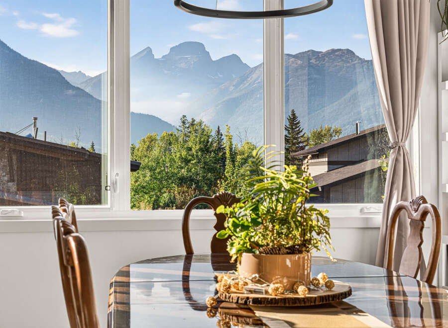 Experience breathtaking mountain views from this stunning dining area, perfect for enjoying meals with a spectacular backdrop.