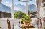 Experience breathtaking mountain views from this stunning dining area, perfect for enjoying meals with a spectacular backdrop.