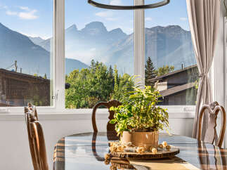 Experience breathtaking mountain views from this stunning dining area, perfect for enjoying meals with a spectacular backdrop.