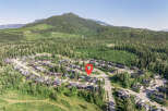 Discover this stunning mountain community offering modern homes nestled amidst lush forests and scenic vistas.