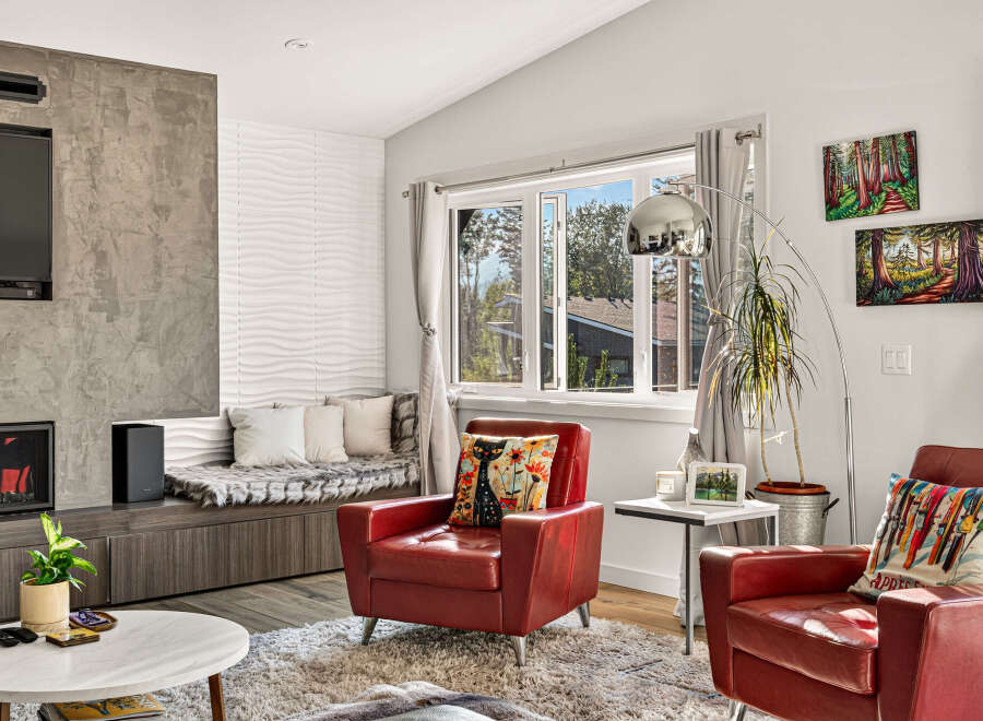 Experience modern living in this stylish living room, featuring a sleek fireplace and entertainment unit.