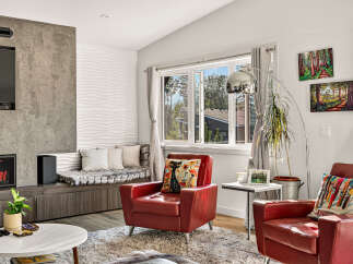 Experience modern living in this stylish living room, featuring a sleek fireplace and entertainment unit.