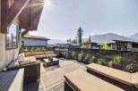 Enjoy breathtaking mountain views from this expansive outdoor living space, perfect for entertaining or relaxing.