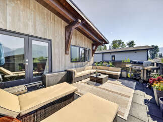 Enjoy stunning mountain views from this expansive rooftop patio, perfect for entertaining.