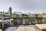 Enjoy breathtaking mountain views from this stunning modern home's expansive rooftop deck.